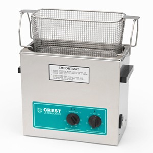 An ultrasonic cleaner with an open weave tray